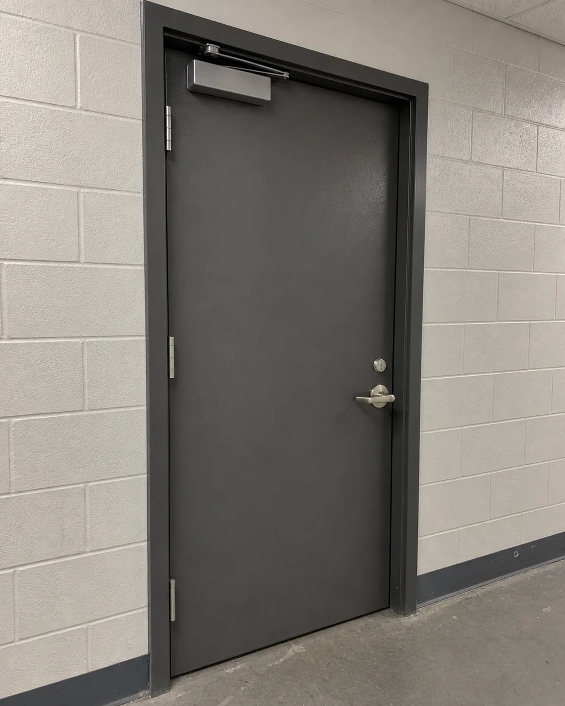 Powder-coated steel service doorset in a commercial building